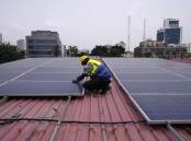 An increase in solar pushed renewables to 30 per cent of global energy production, a report says. (AP PHOTO)