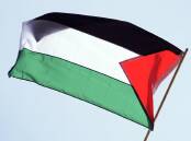A man put a crude device on a neighbour's vehicle after telling him to remove the Palestinian flag. (AP PHOTO)