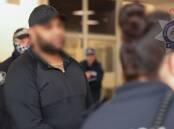 Masood Zakaria is deported to Australia. Picture via AFP