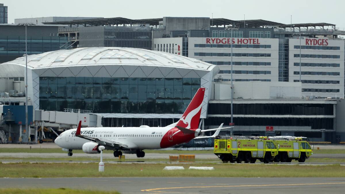 QF144 lands as emergency crews follow at Sydney International Airport in Sydney, Wednesday, January 18, 2023. A Qantas flight has landed at Sydney Airport after issuing a mayday call as it travelled from Auckland, with emergency services rushing to the aircraft. (AAP Image/Jeremy Ng)