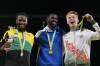Medallists Jaheel Hyde, Kyron McMaster and Alastair Chalmers celebrate after the 400m hurdles. (AP PHOTO)