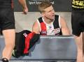 Dan Hannebery of the Saints sits on the bench after being subbed off against Geelong. (Morgan Hancock/AAP PHOTOS)