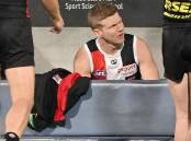 Dan Hannebery of the Saints sits on the bench after being subbed off against Geelong. (Morgan Hancock/AAP PHOTOS)